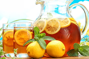 orange fruit with clear glass pitcher